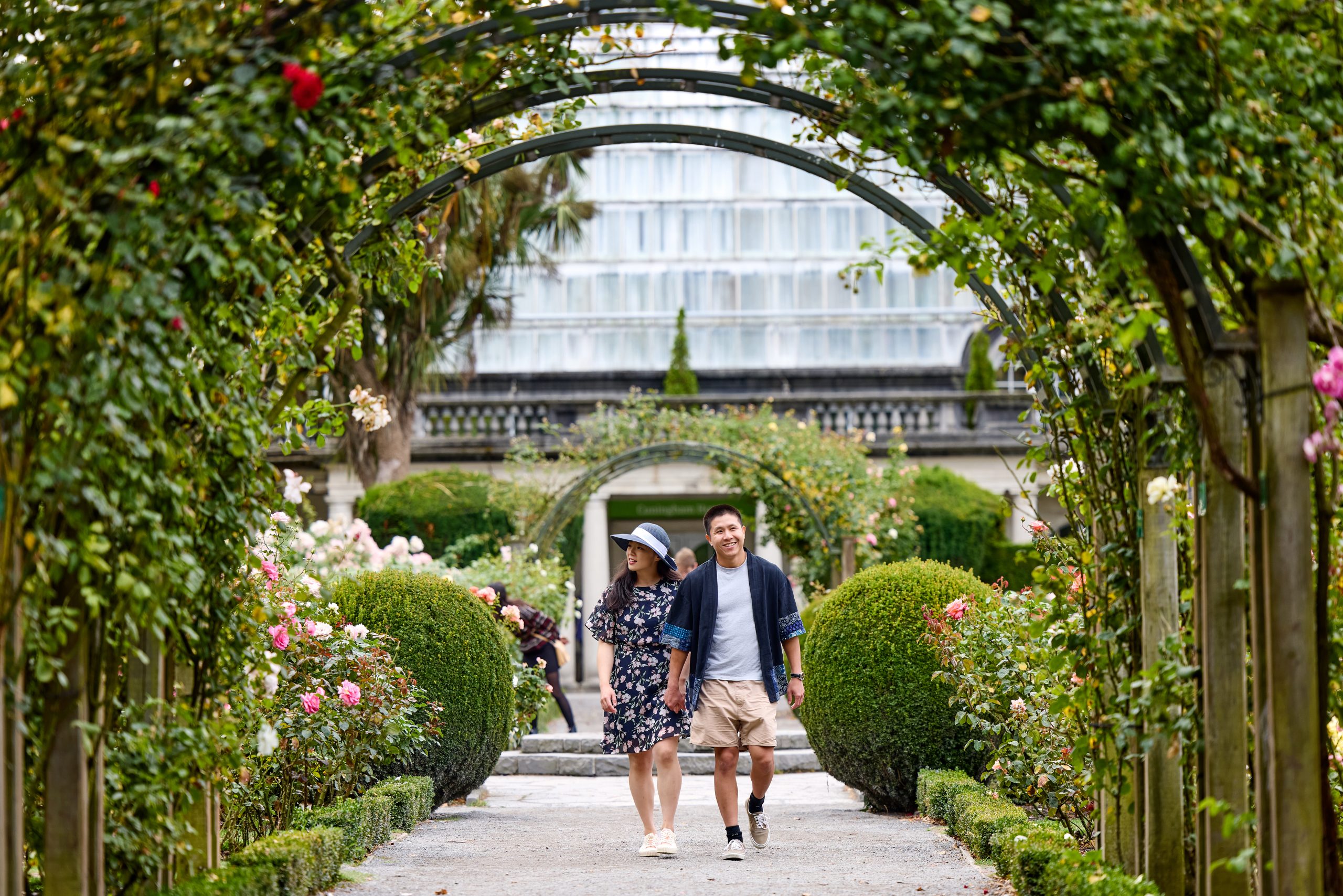 551365-couple-enjoying-the-sceneries-at-the-rose-garden-2